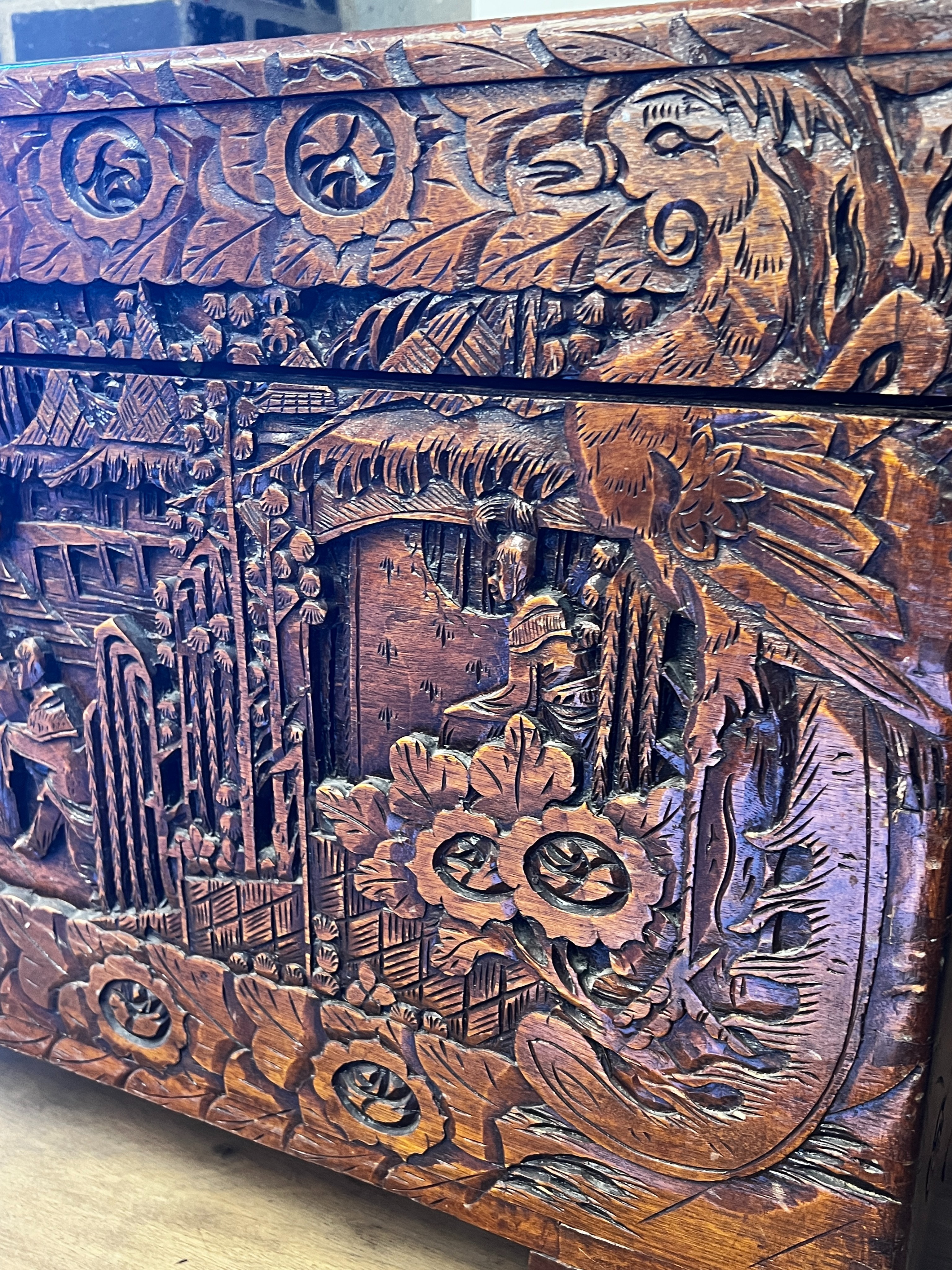 A Chinese carved camphorwood trunk, length 100cm, depth 50cm, height 60cm